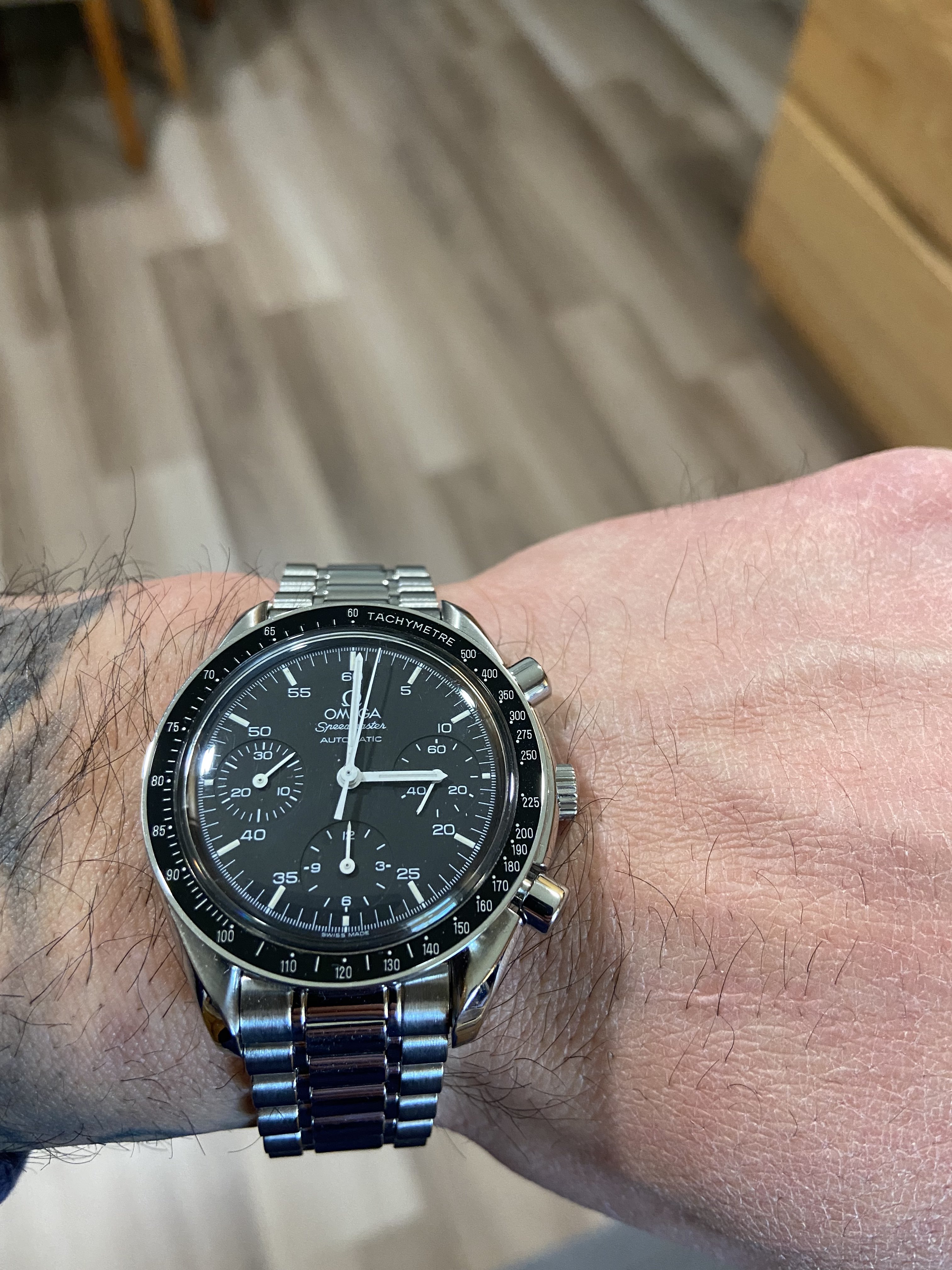 Omega speedmaster sale reduced service cost