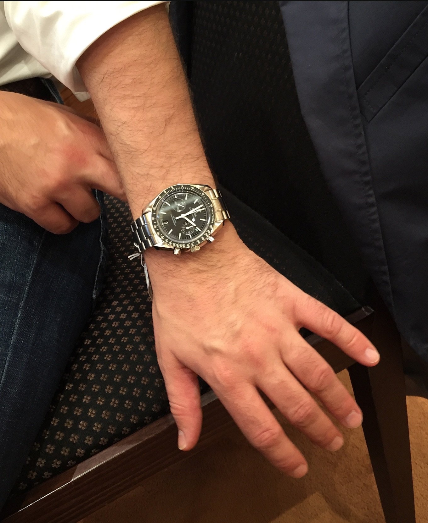 omega speedmaster racing on wrist