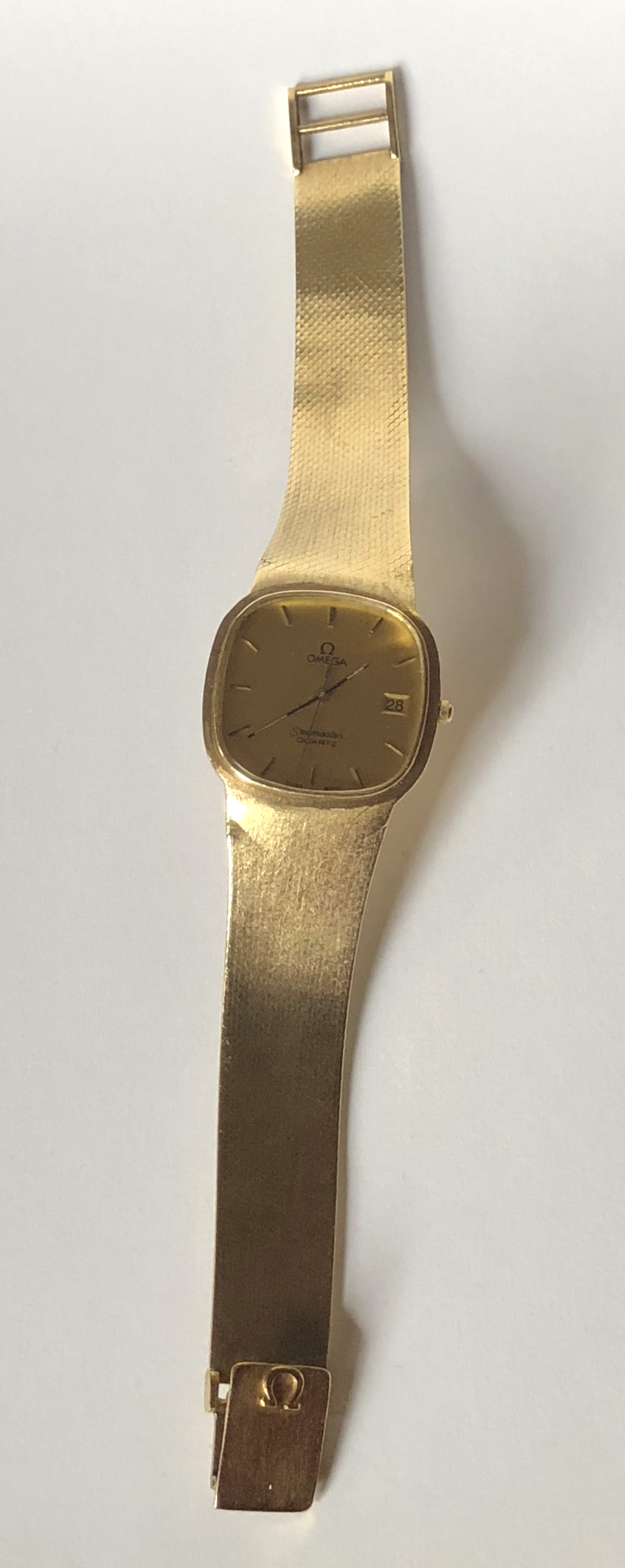 omega solid gold watch