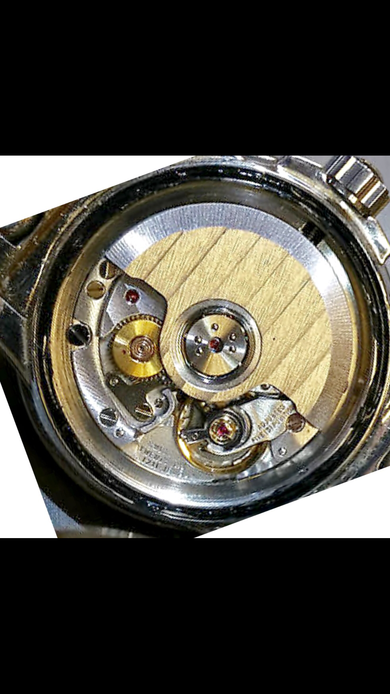 Am I getting scammed on this watch Picture of movements Omega