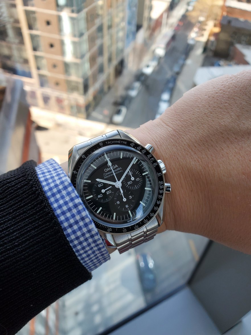 omega speedmaster on wrist