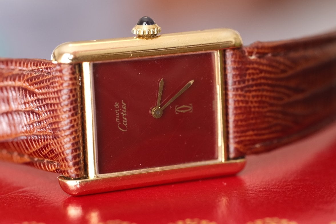 SOLD 1970s Cartier Tank Vermeil mechanical w RARE red dial and