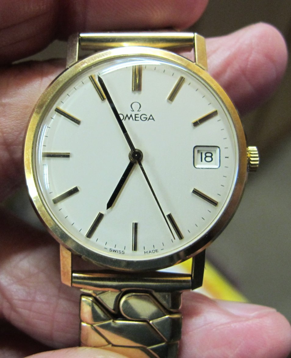 Omega face, back dated to 1975.JPG