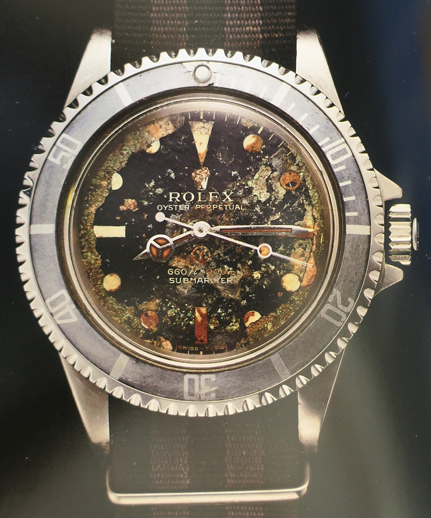 a man and his watch rolex beach.JPG