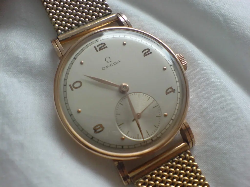 Can you help me identify this vintage gold omega watch | Omega
