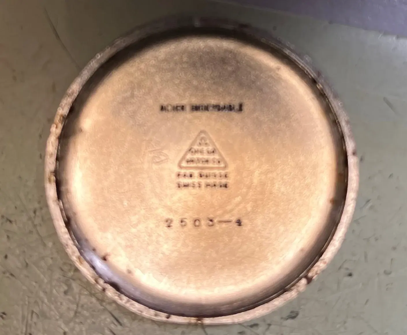 1947 Omega case back inside trimmed.webp