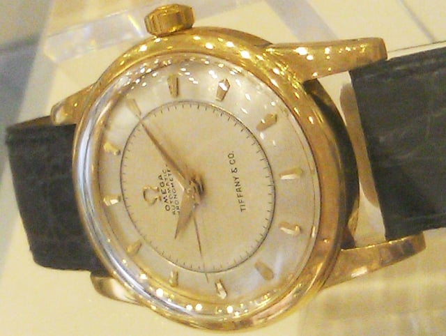 E28 Case 91 Official retailer Gold Tiffany chronometre watch.jpg