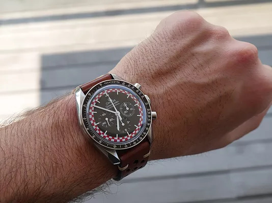 Omega Speedmaster Tin Tin Front BROWN Strap WRIST SHOT.jpg