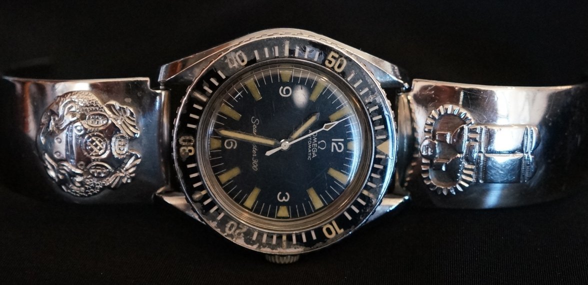 Olongapo bracelet with US Armed Forces Deep Diver 1st Class symbols.JPG